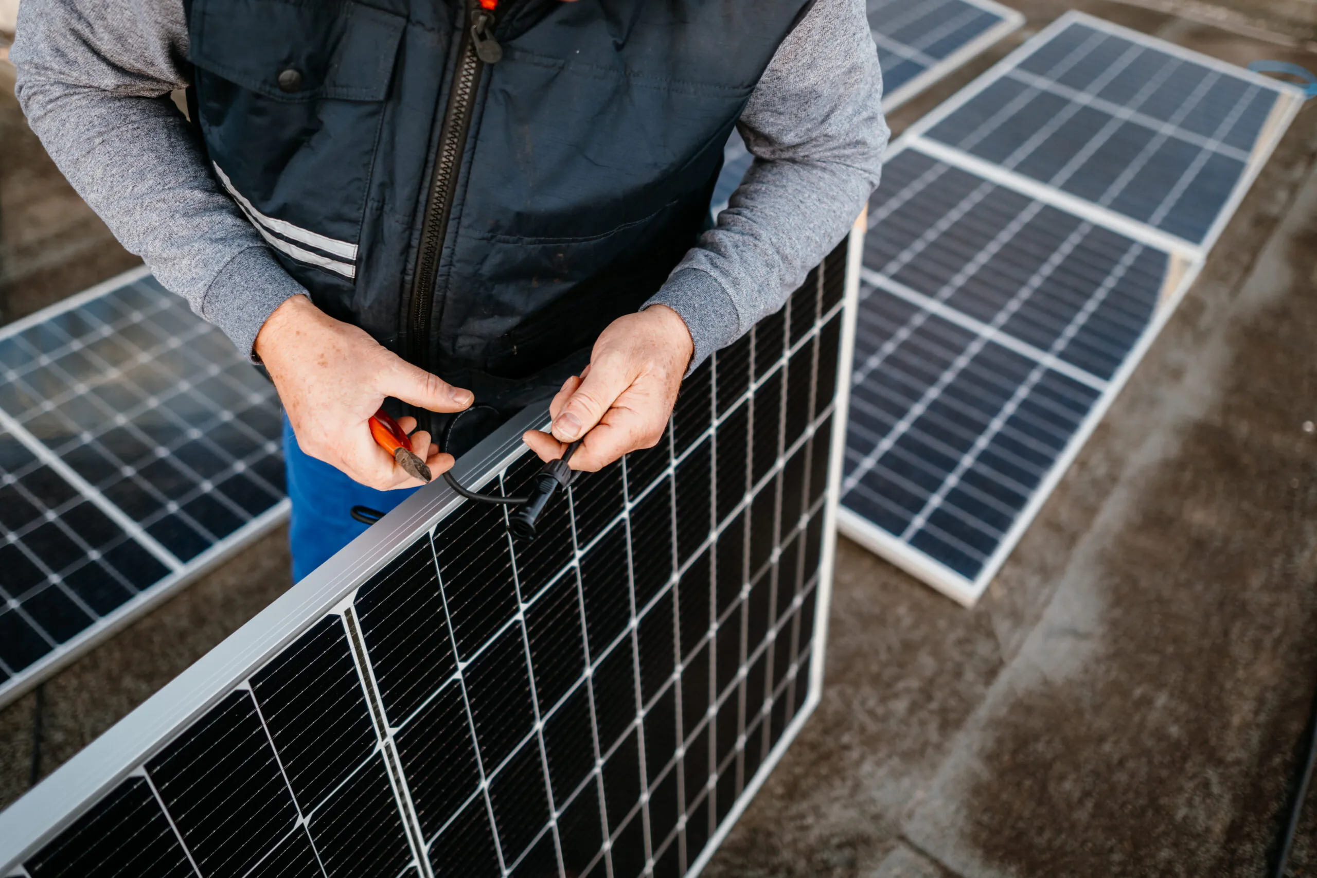 high angle view engineer inspecting solar panel scaled